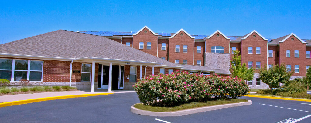 Les Chateaux building exterior with entrance circle drive.