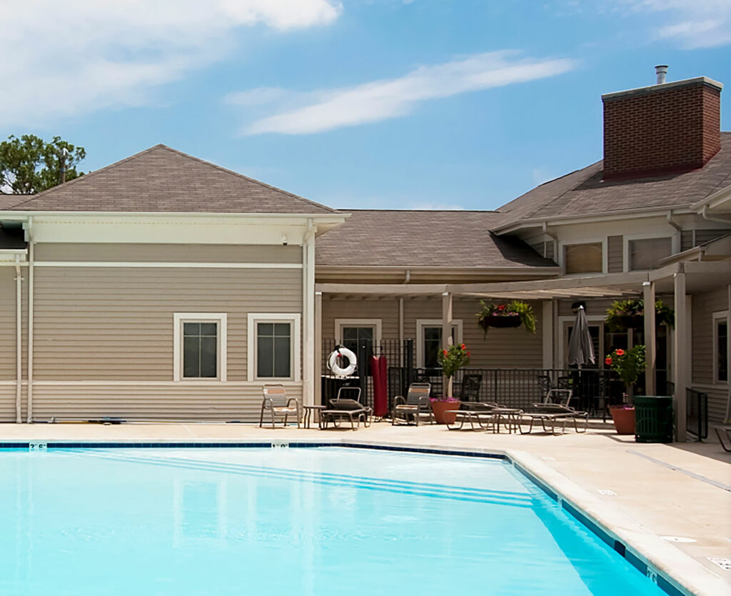 Renaissance Place At Grand building exterior with pool.